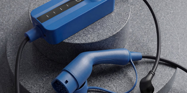 Hand holding the in-cable control box of the Voldt® Portable Charger