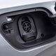 Close-up of a Type 1 charging port on a silver electric car